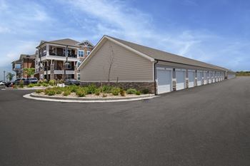 the building where the motel is located is next to a parking lot  at Watermark at Harvest Junction, Longmont, Colorado